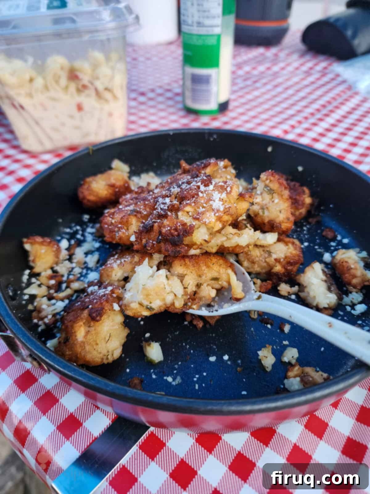 Golden Pie Iron Potato Pockets 3 prepared tater tots on dish with spoon