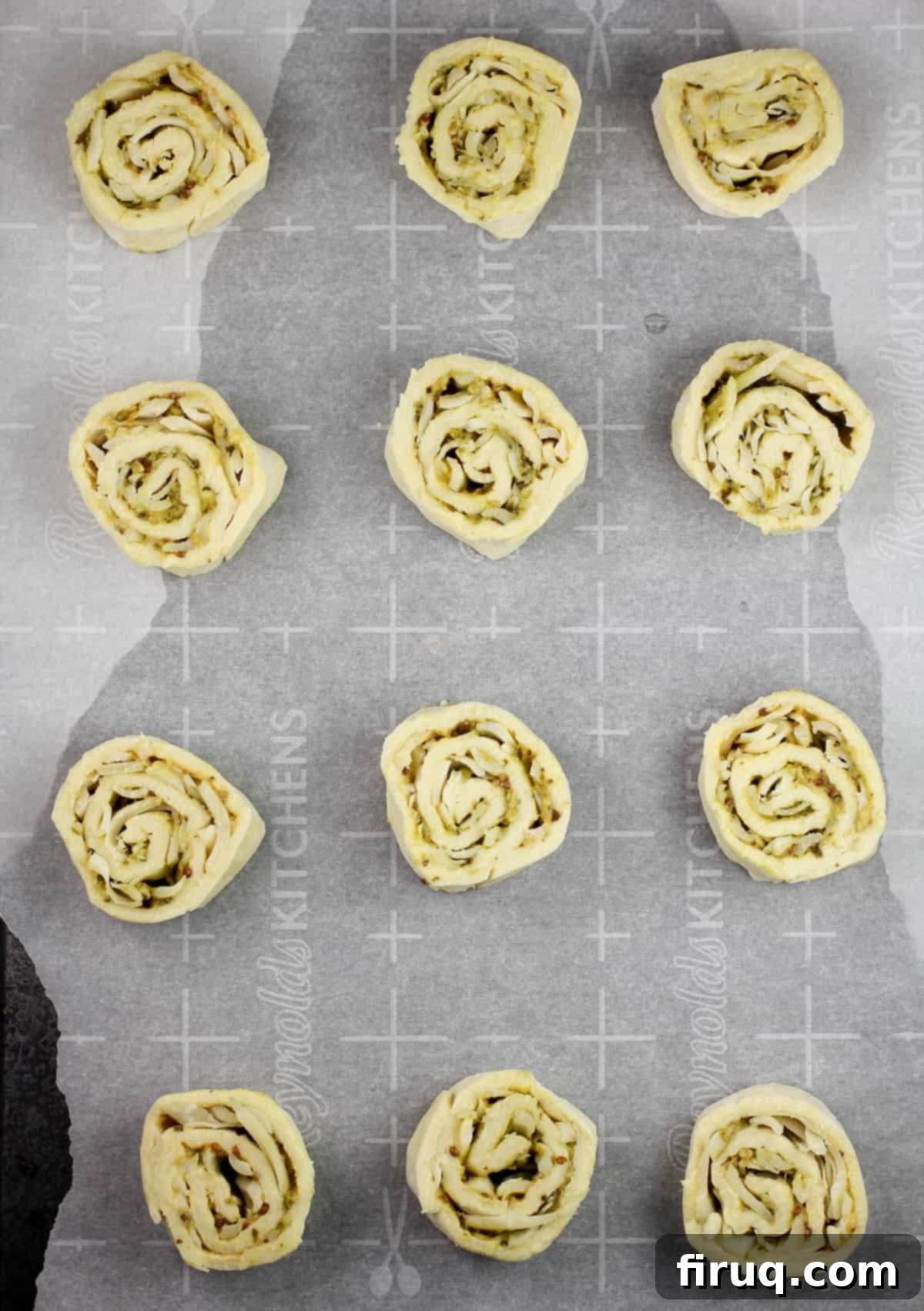 Savory Pesto Spirals 6 prepared pinwheels on bake sheet prior to baking