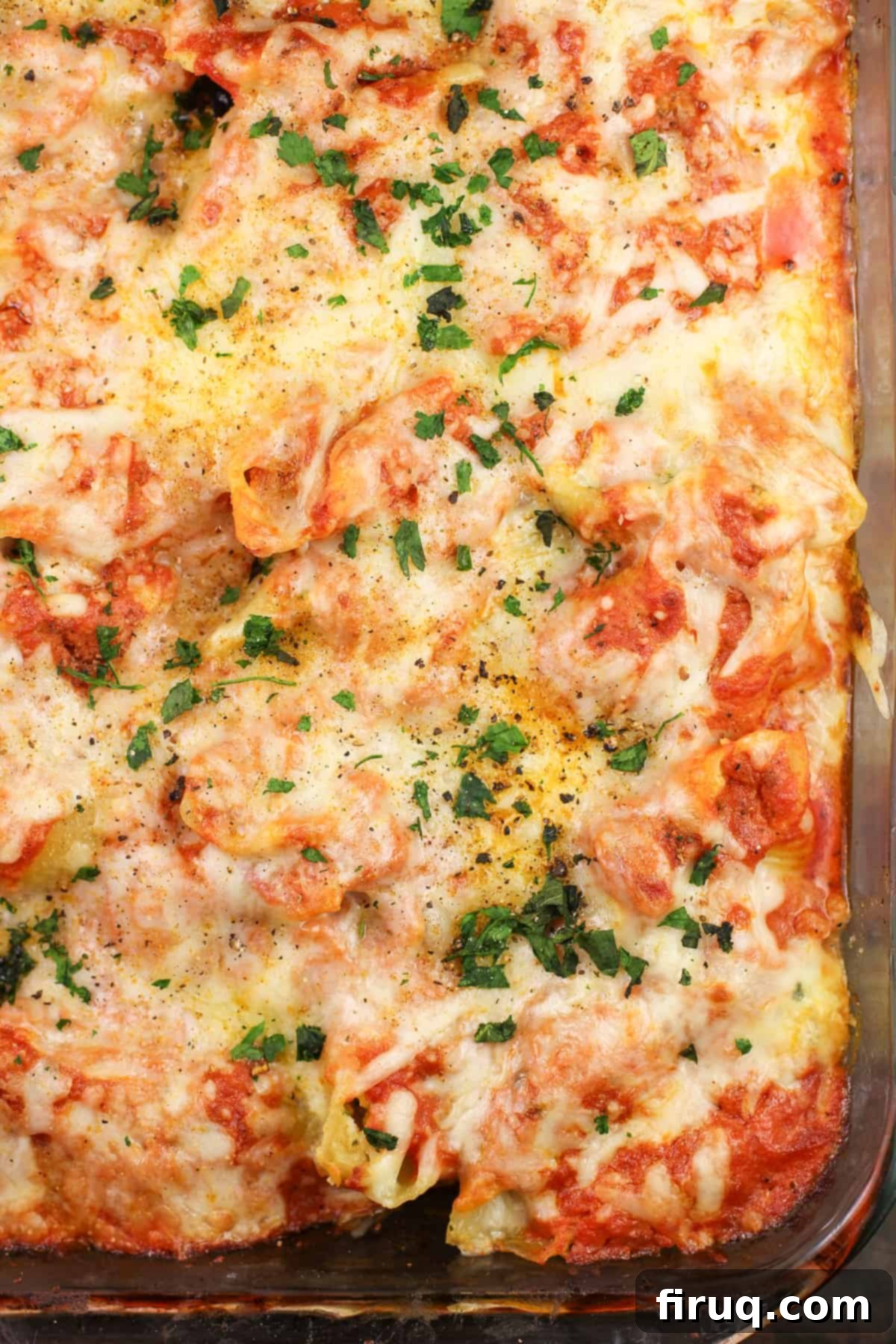 Zesty Cajun Shrimp and Crab Stuffed Shells with Creamy Vodka Sauce 3 A casserole dish filled with fully cooked Cajun Shrimp and Crab Stuffed Shells, fresh from the oven, with bubbling sauce and melted cheese.