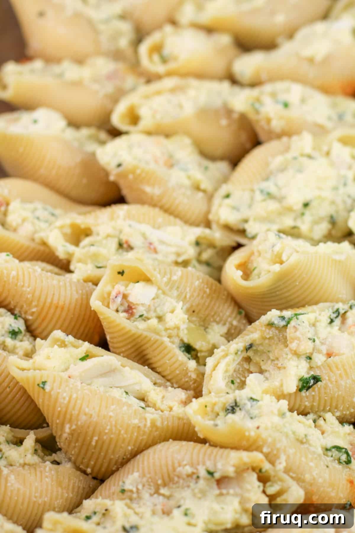 Zesty Cajun Shrimp and Crab Stuffed Shells with Creamy Vodka Sauce 7 Uncooked, stuffed pasta shells neatly arranged in a baking dish, before being topped with the creamy vodka sauce and cheeses.