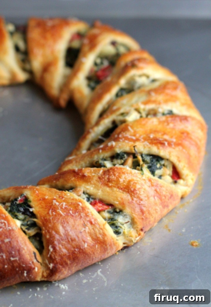 Mediterranean Crescent Wreath 14 Close-up of a slice of Mediterranean Crescent Ring, showcasing the rich filling and flaky crust